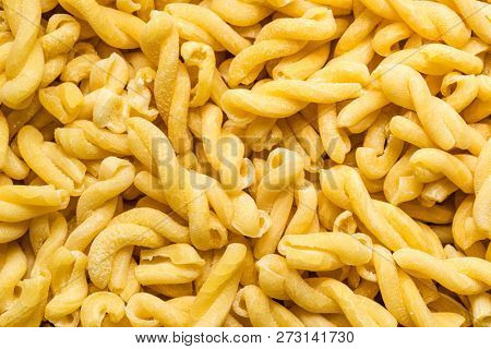 Uncooked gemelli pasta. Top view.