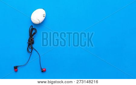 Sad Chicken Egg Man With Headphones Body Is Walking Away On The Blue Background.
