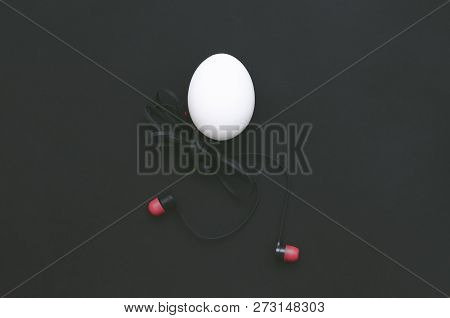 Chicken Egg With Headphones Body Is Walking On The Blue Background.