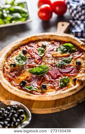 Pizza Diavolo Traditional Italian Meal From Spicy Salami Peperoni Chili Onion Olives And Basil