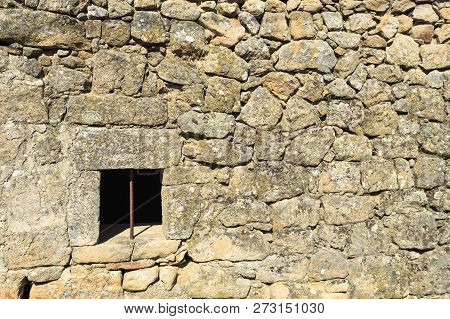 View Of A Wall Showing The Traditional Granite Stone Masonry Architecture And A Ventilation Slot Of 