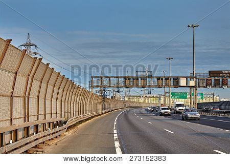 St. Petersburg, Russia - August 28, 2018: Automobiles Drive Along The Highway With Road Safety Barri