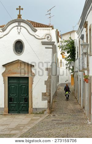 Nossa Senhora Da Piedade Church, Located Along A Typical Cobbled Narrow Street Inside The Old Town O