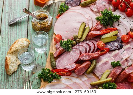 Charcuterie Board With Sausages And Smoked Meat. Top View.