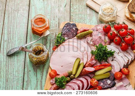 Charcuterie Board With Sausages And Smoked Meat. Top View.