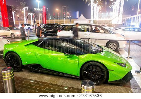 Dubai, Uae - December 23, 2017: Supercar Lamborghini Huricane Greeen Color Parked Next To Dubai Mall