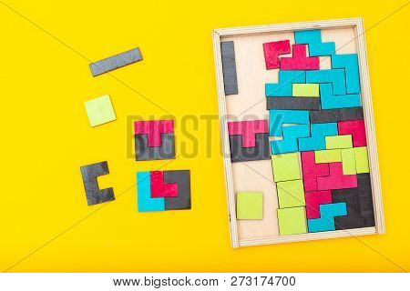 Tangram Game Bright Colorful On Yellow Background. Flat Lay
