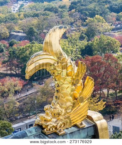 Osaka, Japan, November 25, 2018: Shachihoko (shachi) At World Famous Osaka Castle Roof In Autumn Wit