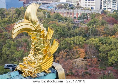 Osaka, Japan, November 25, 2018: Shachihoko (shachi) At World Famous Osaka Castle Roof In Autumn Wit