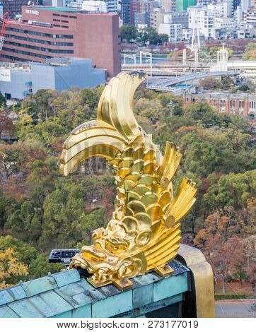 Osaka, Japan, November 25, 2018: Shachihoko (shachi) At World Famous Osaka Castle Roof In Autumn Wit