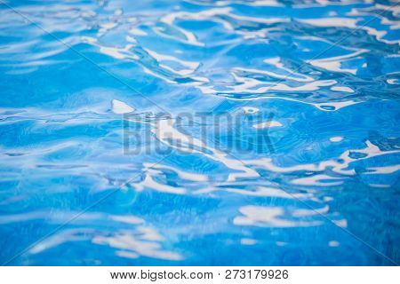Clear Blue Water With Waves In The Swimming Pool, Background.