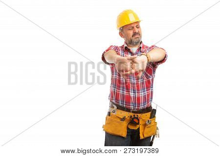 Builder Cracking Joints As Preparing For Hard Work Isolated On White Studio Background