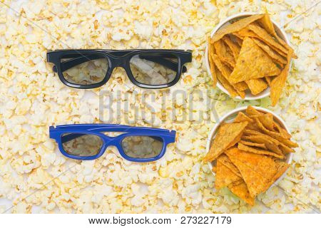 Two Buckets Of Nachos And 3 D Glasses, On The Background Of Spilled Popcorn