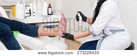 Podology Treatment. Podiatrist Treats Foot. Podiatry Doctor Or Dermatologist Treats The Patient In M