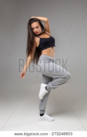 Modern Style Dancer Posing On Studio Background. Hip Hop, Jazz Funk, Dancehall