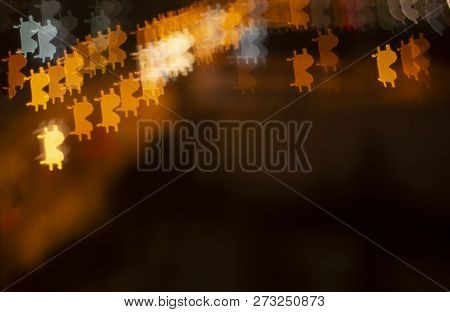 Background Of Bitcoin Symbols.on A Dark Foggy Background Cryptocurrency Bitcoin.uncertain Background