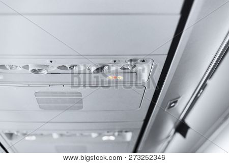 Overhead Console Of The Airplane With No-smoking Sign Remind Indicator