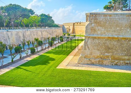 The Walking Area Of Ornamental Garden At The Bottom Of Former Moat Of Medieval Mdina Citadel, Malta
