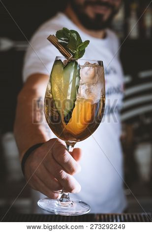 Barman Gives A Cocktail To The Client Of The Hotel Bar.