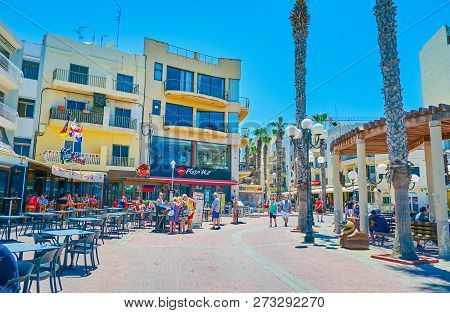 Bugibba, Malta - June 14, 2018: Bay Square, Located On The Coast, Is The Main Shopping And Gourmet A