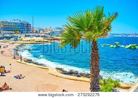Bugibba, Malta - June 14, 2018: The Stormy Morning At Bugibba Perched Beach Holds Tourists On The Co