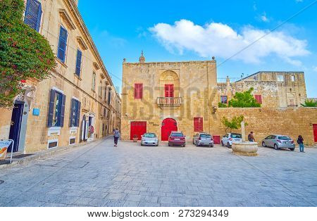 Mdina, Malta - June 14, 2018: The Small St Agatha Square With Small Stone Fountain With A Pillar And