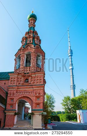 The Belfry Of The Ornate Ostankino Life-giving Trinity Church And The Modern Ostankino Tower On The 