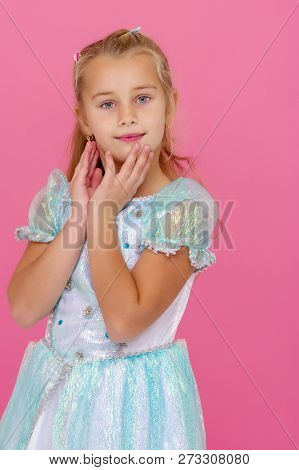 Beautiful Little Girl On A Pink Background. Concepts Style And Fashion, Happy Childhood.
