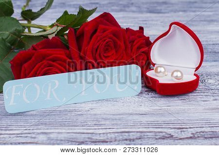 Valentines Day Gift On Wooden Background. Red Velvet Box With Gold Jewelry And Red Roses. Beautiful 