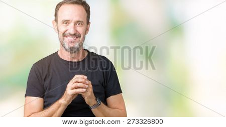 Handsome middle age hoary senior man over isolated background Hands together and fingers crossed smiling relaxed and cheerful. Success and optimistic