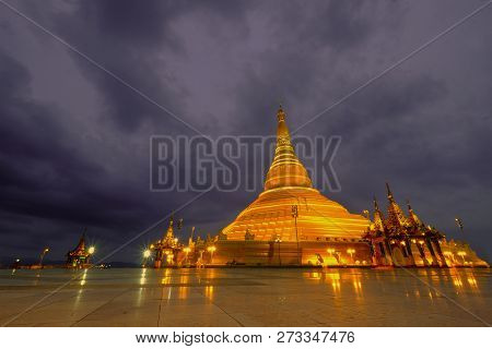 Golden Color Uppatasanti Pagoda In Nay Pyi Taw Capital City, Myanmar, In The Evening With Dramatic C