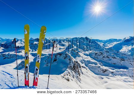 Ski in winter season, mountains and ski touring backcountry equipments on the top of snowy mountains in sunny day, Verbier Switzerland.