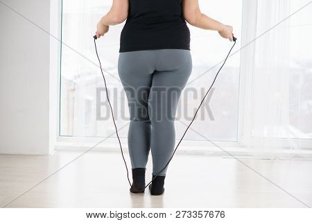 Weight Loss, Endurance, Jump-fit, Vitality, Active Lifestyle. Overweight Woman With Jumping Rope Car