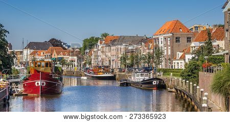 Panorama Of A Canal With Old Ships And Historical Houses In Zwolle, The Netherlands