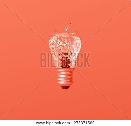 Glass Textured Strawberry Lightbulb Idea On Creative Leaving Coral Background.