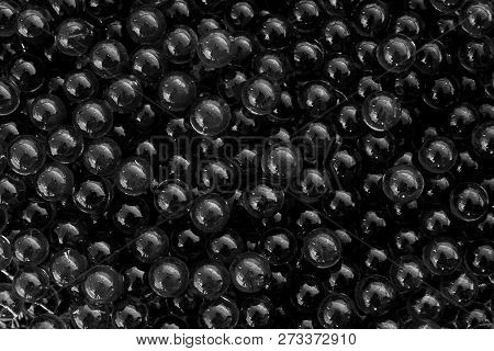 Water Black Gel Balls With Bokeh. Polymer Gel. Silica Gel. Balls Of Black Hydrogel. Crystal Liquid B
