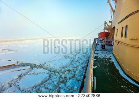 Unforgettable excursion to the arctic tourist cruise on the sea icebound. Dim winter morning in Lapland. The concept of active and extreme tourism