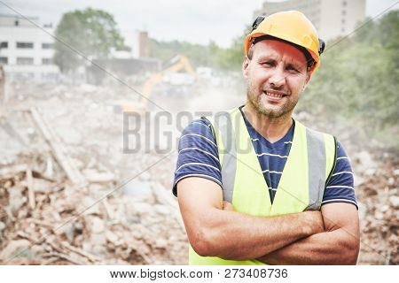 Demolition construction work. Worker at building site