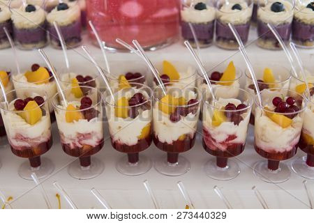 Candy Bar. Delicious Sweet Buffet With Cupcakes. Sweet Holiday Buffet With Cupcakes And Other Desser