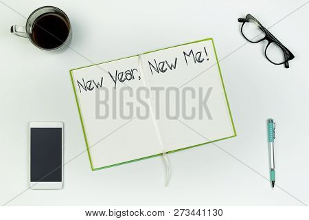 New Year, New Me Concept. Top View Of Open Copy Book On White Table With 