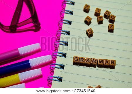 Grammar. Motivation Message Written On Wooden Blocks. Cross Processed Image