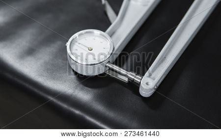 Leather Thickness Gauge On Natural Black Leather. Preparing Of The Raw Materials For Manufacture Of 