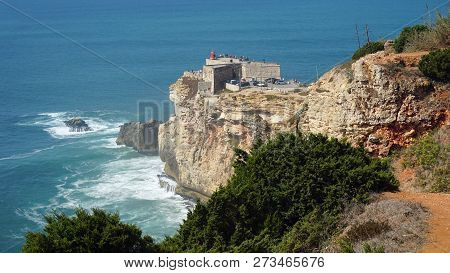 Famous Surf Spot At Nazare Lighthouse In Portugal