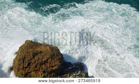 Rough Waves Touching Coast At Nazare In Portugal