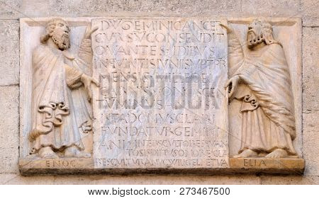 MODENA, ITALY - JUNE 04: The prophets Enoch and Elijah hold the epigraph with the foundation date of the temple and the name of Wiligelmo, Modena Cathedral, Italy on June 04, 2017.