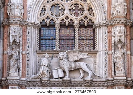 VENICE, ITALY - MAY 28 : Detail of the Porta della Carta entrance to the Doge's Palace in Venice, Italy, depicting Doge Francesco Foscari kneeling before the Lion of St. Mark, on May 28, 2017.