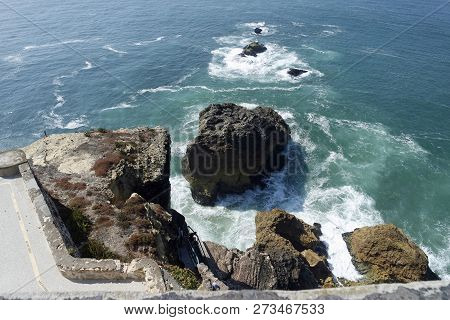 Shore Line Of Small Tourist Village Nazare In Portugal