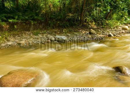 The Beautiful Paniki River With Its Gentle Flow And Brownish Yellow Water During The Rainy Season