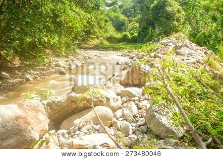 The Beautiful Paniki River With Its Gentle Flow And Brownish Yellow Water During The Rainy Season