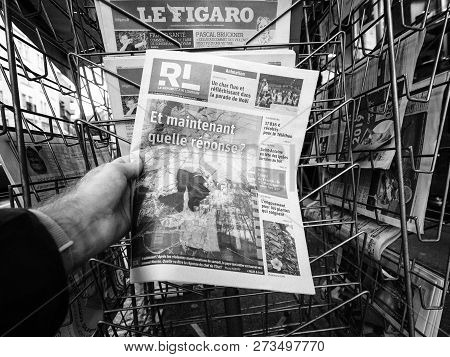 Paris, France - Dec 10, 2018: Newspaper Stand Kiosk Stand Selling Press With Man Hand Buying Le Repu
